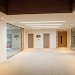 Wide office hallway with recessed ceiling lighting and shadow gap detail at 59 Buckingham Gate, London Victoria