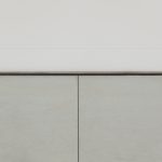 Seamless abutment shadow gap skirting wall-to-tile junction close-up detail – B2B Kings Cross
